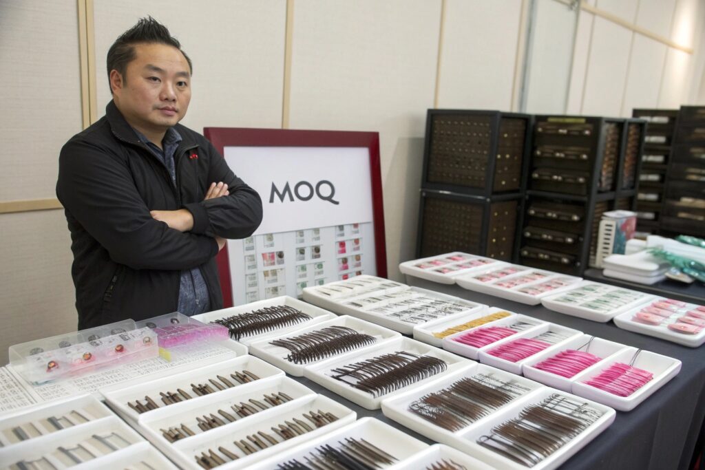 Chinese Supplier Showcasing Assorted Hair Clips and Pins at Wholesale Booth