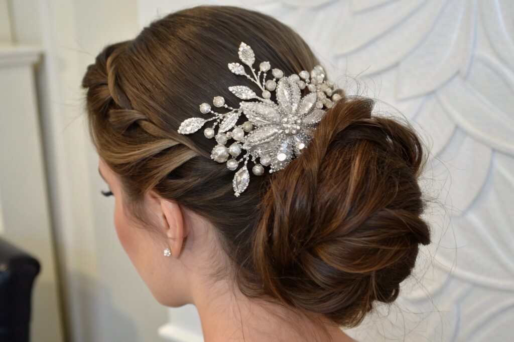 A woman with a braided bun hairstyle and a decorative hair clip