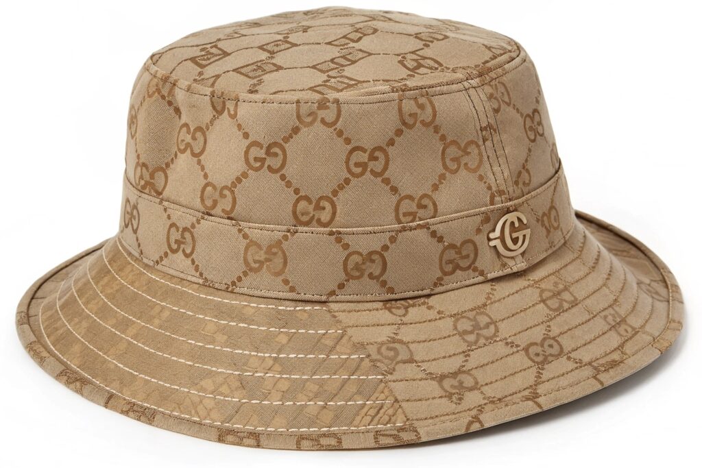 A beige Gucci GG Canvas Reversible Bucket Hat