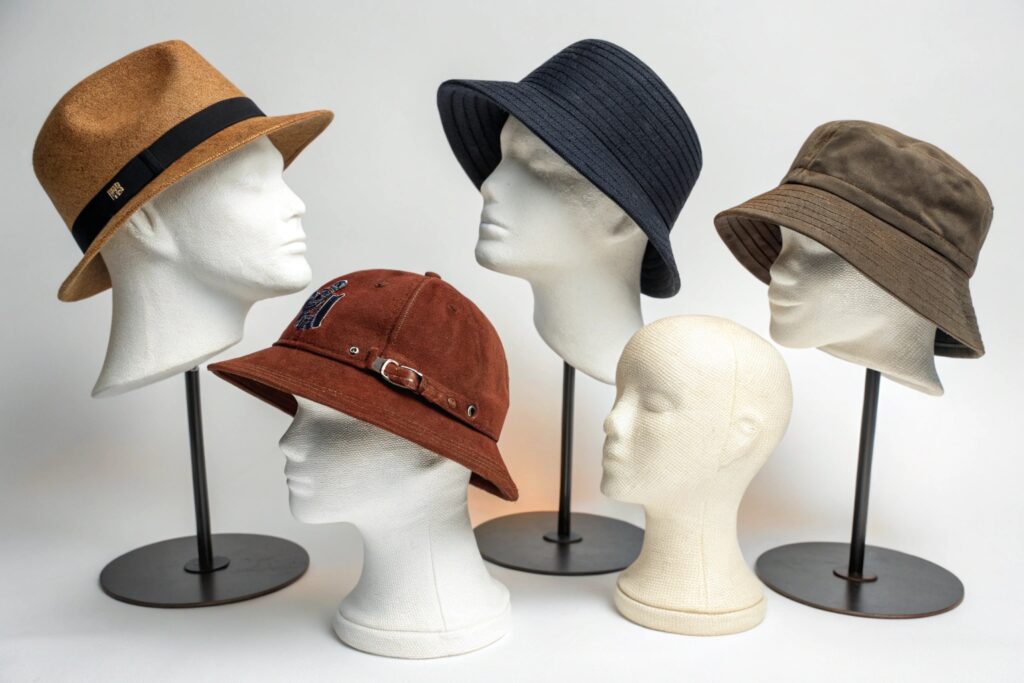 Five hats on mannequin heads
