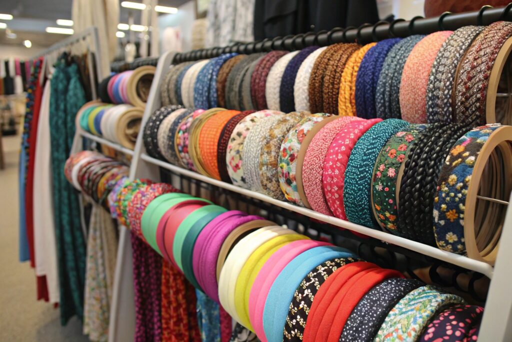 Rows of colorful headbands displayed on a rack in a store