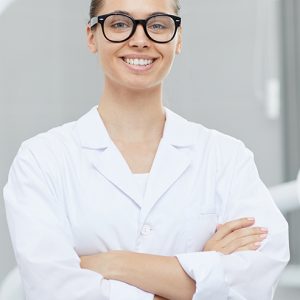 female-dentist-posing-in-office-H89D7UA-1.jpg